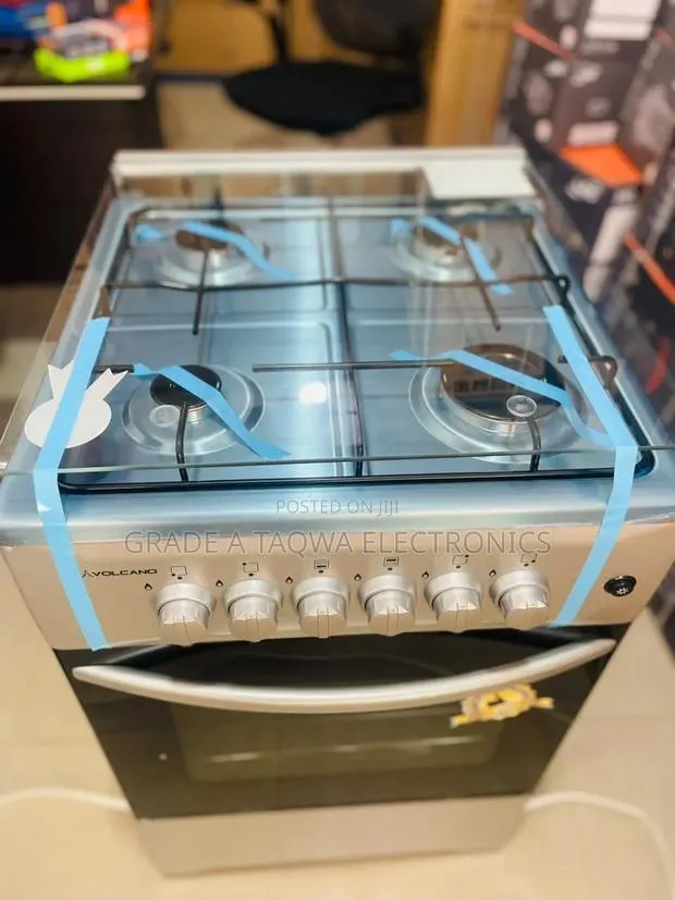 A Glass Top Lid Volcano 50-50 Four Burners Gas Cooker · Photo 1