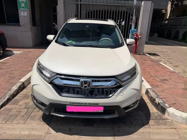 Honda CR-V Touring AWD 2019 Beige · Photo 1