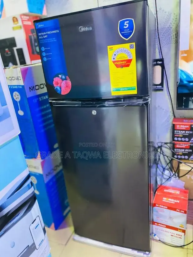 332 KWh/year Midea 204-L Bottom Freezer · Photo 1